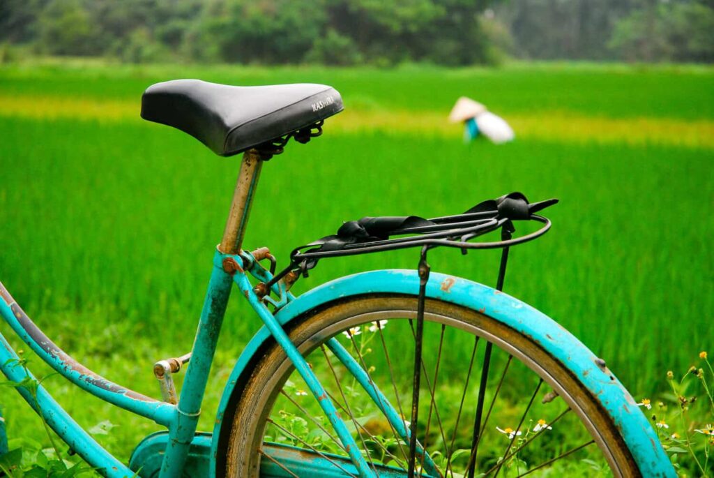 Aqua bike with Vietnamese farmer in background with traditional hat on Cat Ba island, Vietnam.