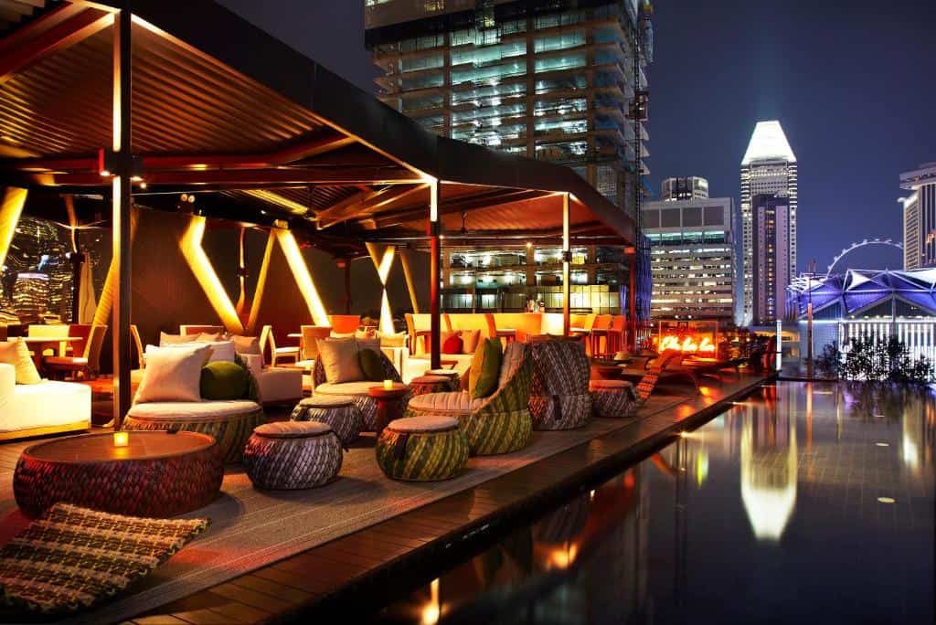 Naumi Hotel: Bright contemporary room at Naumi Hotel Singapore with floor-to-ceiling windows and city view