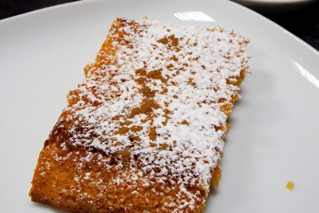 Portuguese almond cake Toucinho do Céu, made with almonds, port wine, lemon peel, eggs, and pumpkin jam.”