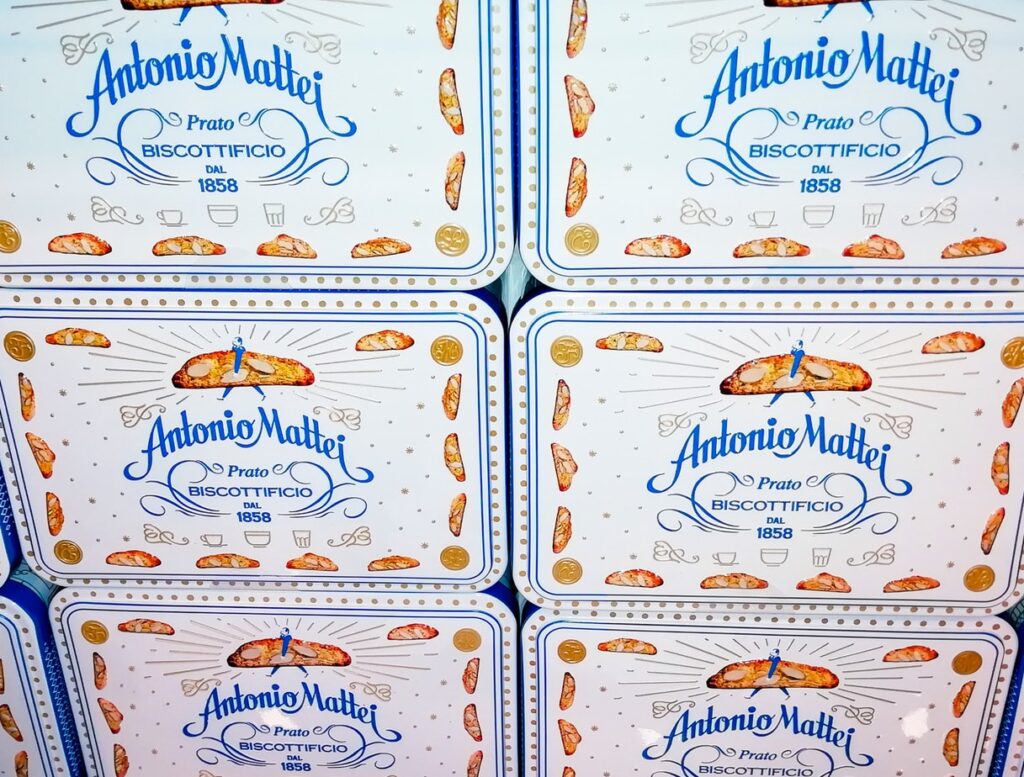 Traditional Tuscan cantucci biscuits displayed in tins on the Florence Foodies Walk
