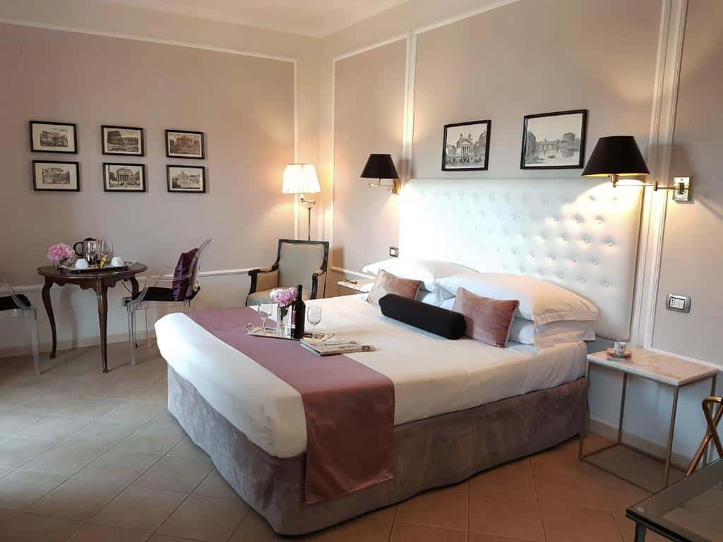 Bright double room at Althea Inn Roof Terrace in Rome with balcony access and warm, inviting décor.