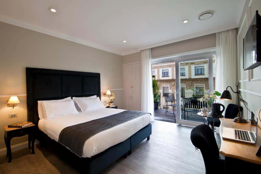 Elegant room at Seven Suites in Testaccio, Rome, featuring a private terrace, modern design, and stylish neutral palette.