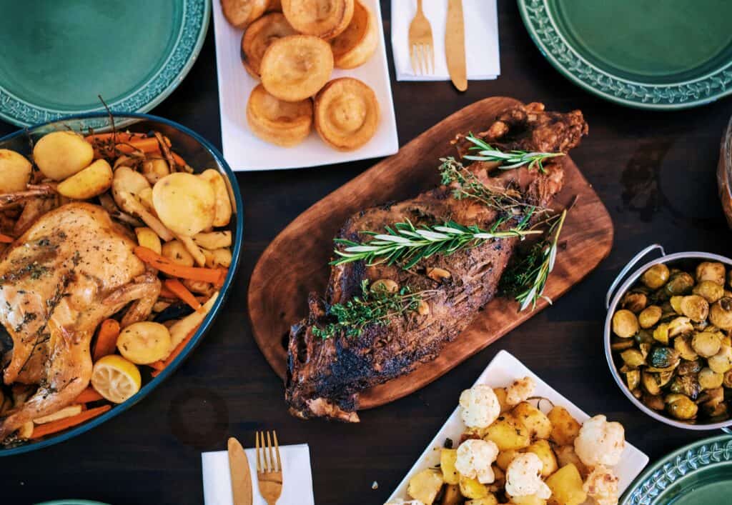 traditional English roast dinner with roasted meat, crispy potatoes, Yorkshire pudding and vegetables served with gravy