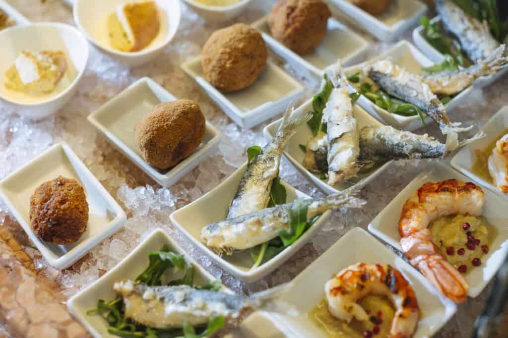 Venetian cicchetti polpette and shrimps with polenta