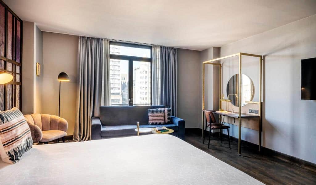 Botanical-themed boutique room at Hotel Indigo Brussels with leafy prints and nature-inspired design