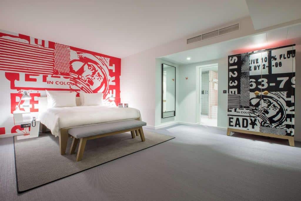 Bright modern room at Radisson RED Brussels with bold artwork