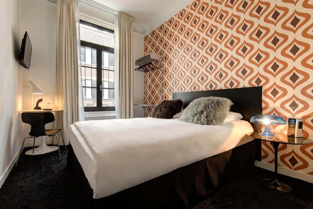 clectic vintage-styled room at Vintage Hotel Brussels with retro décor and warm lighting