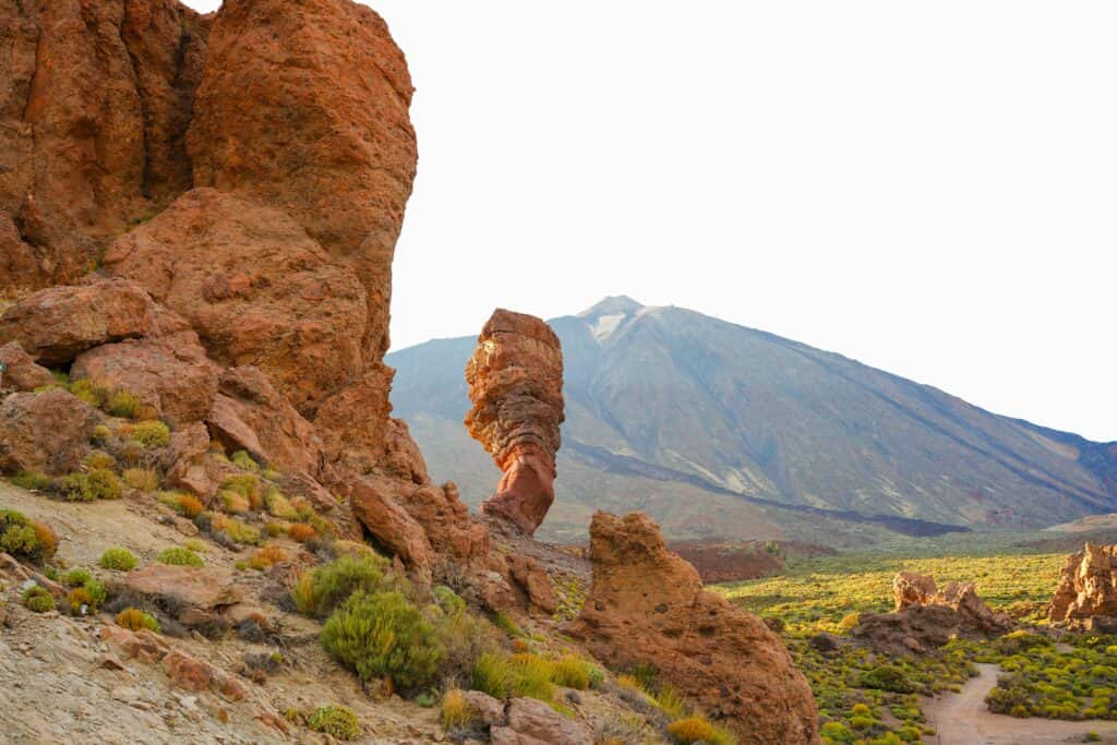 Rock formation shaped like a finger at Teide National Park in Tenerife, Spain, with volcanic landscape and Mount Teide in the background.”