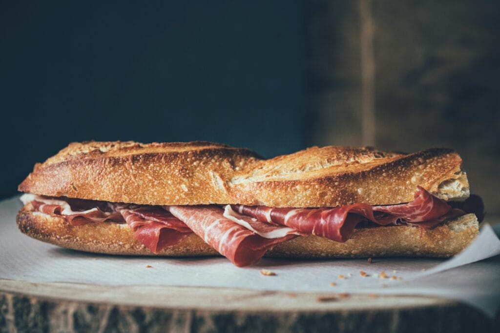 Jambon beurre baguette sandwich with ham on crusty French bread