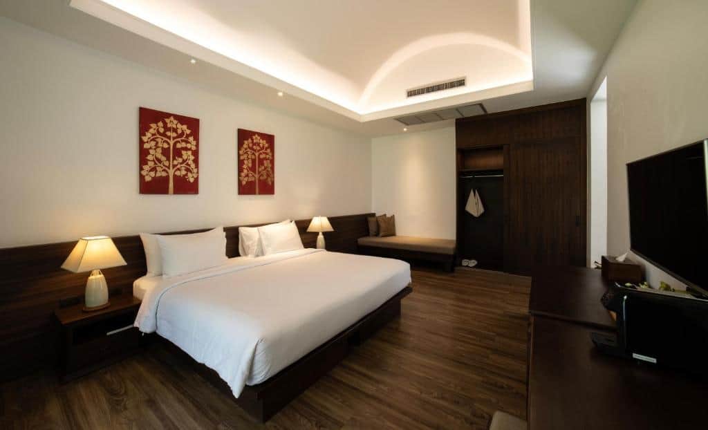 Modern beachfront bedroom with clean design and pool access at Celes Resort Koh Samui