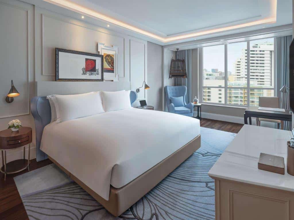 “Luxury bedroom at Sofitel Bangkok Sukhumvit with city view window