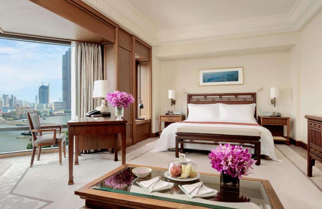 “Spacious luxury bedroom at The Peninsula Bangkok with river views