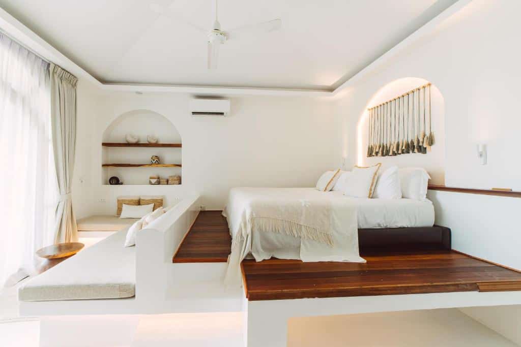 ropical-inspired bedroom with wooden details at Zazen Resort Koh Samui
