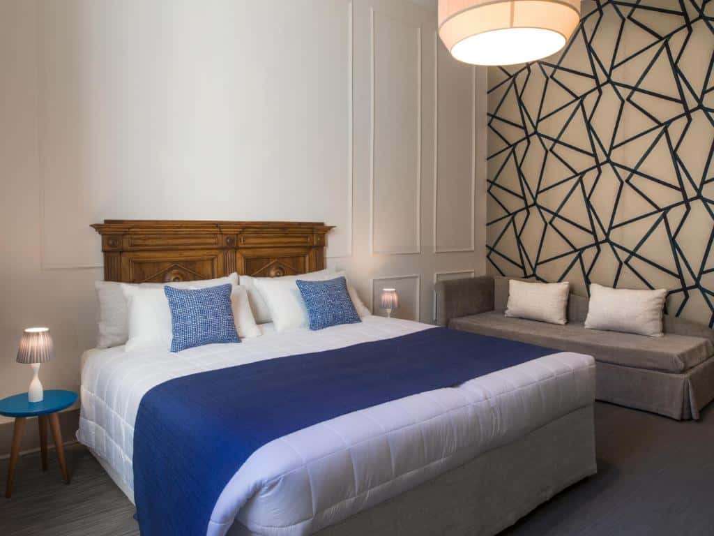Contemporary bedroom with geometric wall design at Alfieri9 boutique hotel in Florence.