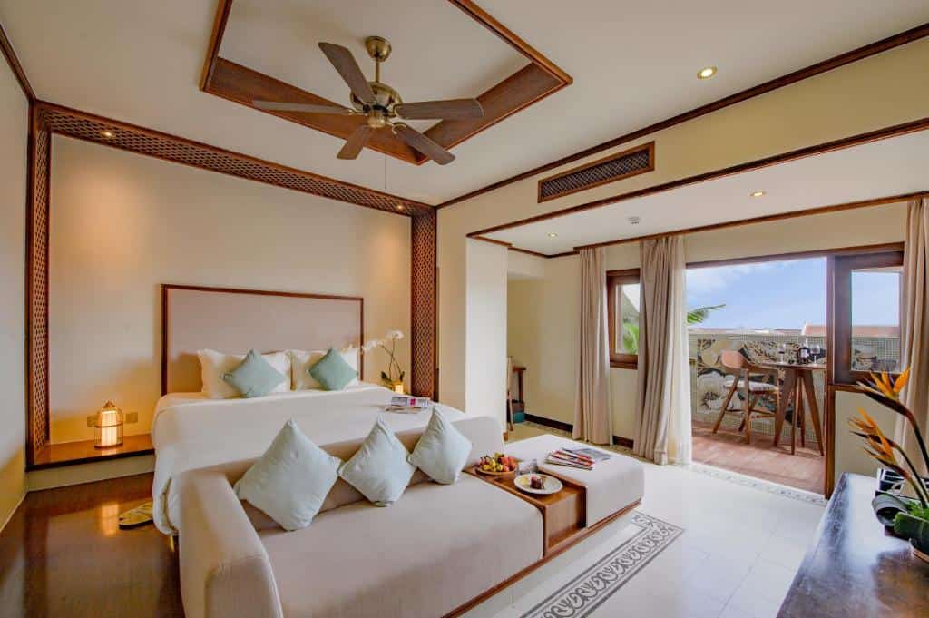 Modern hotel room with clean design and pool view at Almanity Hoi A