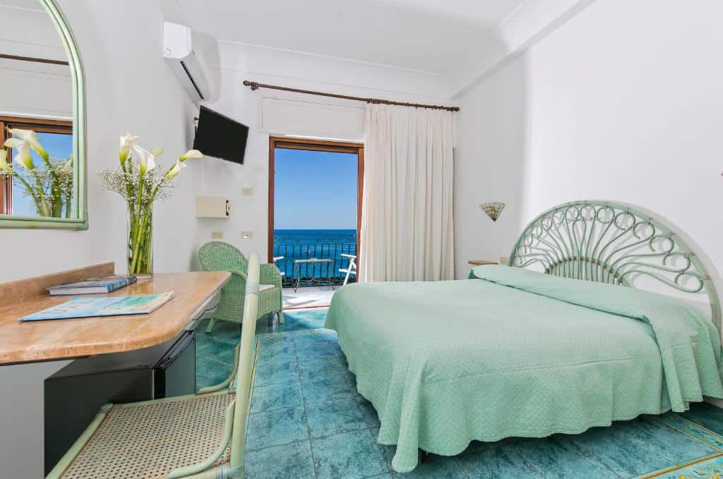 Bright bedroom at Hotel Pupetto near Fornillo Beach in Positano