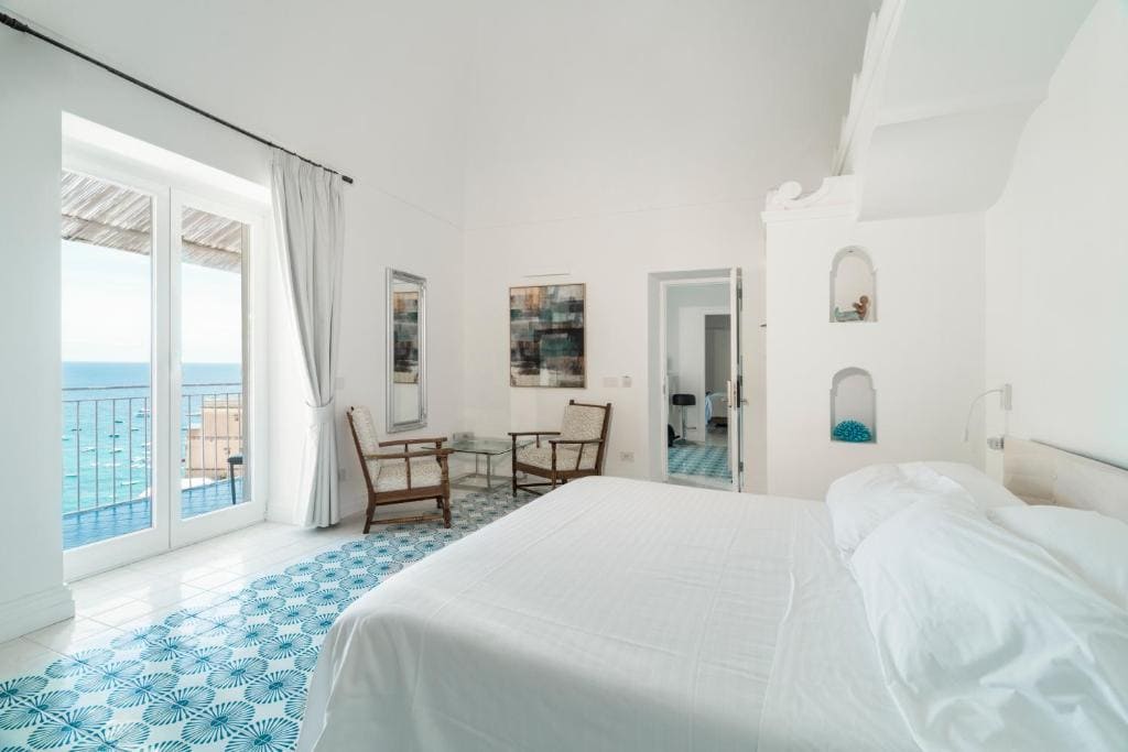 Modern sea-view bedroom at Villa Magia in Positano with terrace
