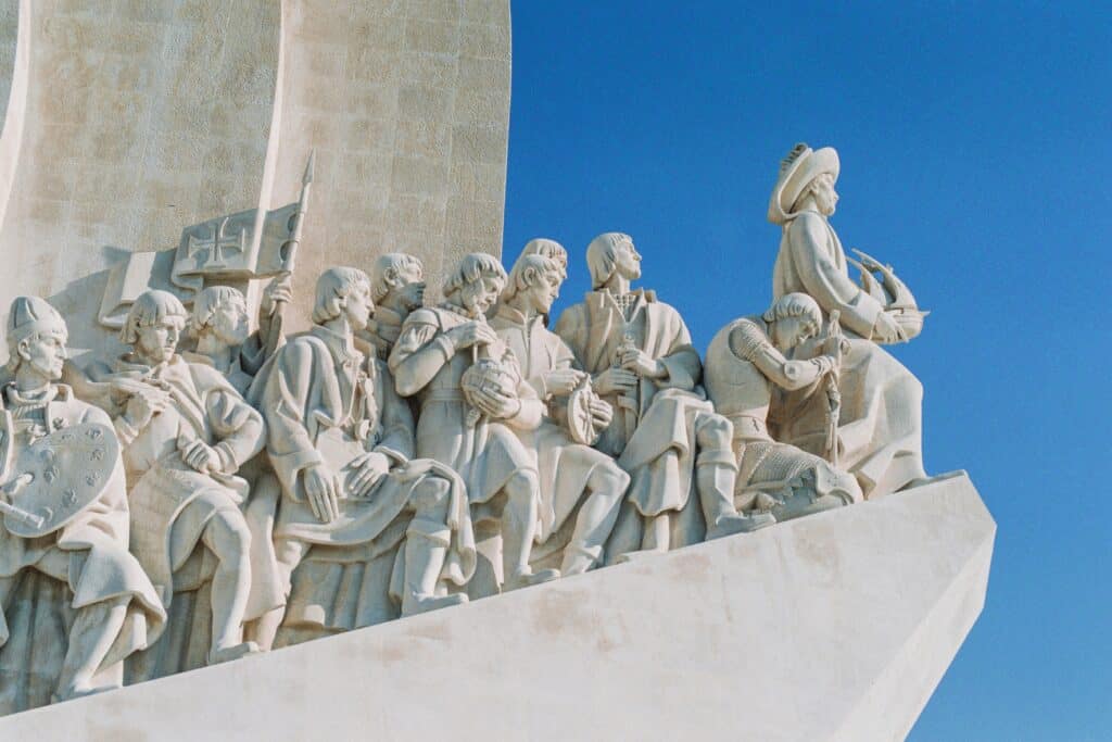 Monument to the Discoveries in Belém Lisbon featuring stone figures of Portuguese explorers overlooking the Tagus River