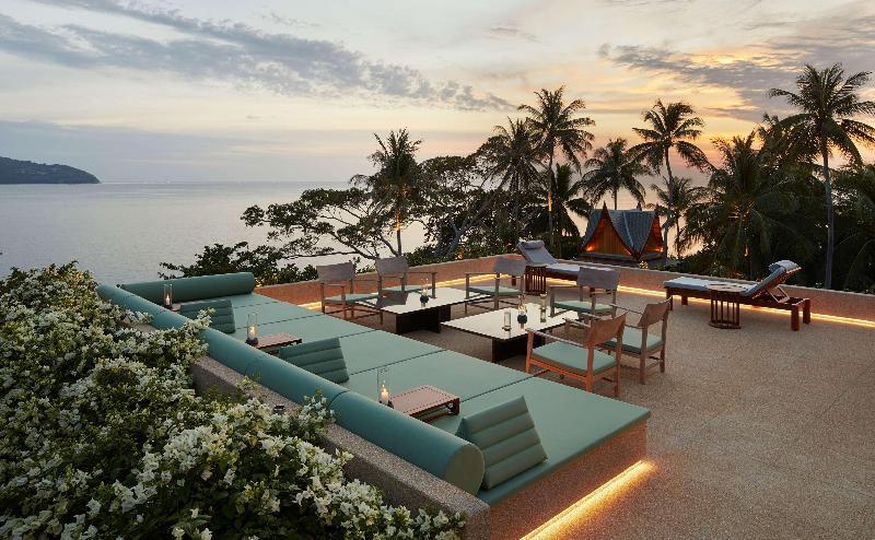 Amanpuri Phuket rooftop terrace with sea views, tropical palms and sunset seating area above Pansea Beach