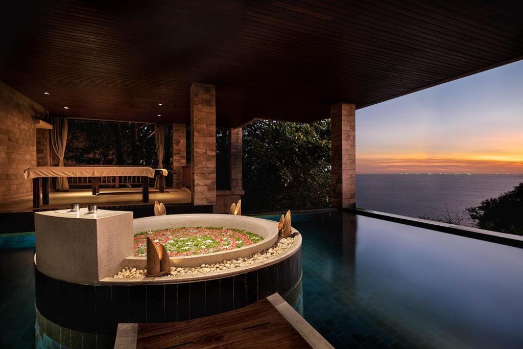 Paresa Phuket cliffside infinity pool villa and open-air spa overlooking the Andaman Sea at sunset