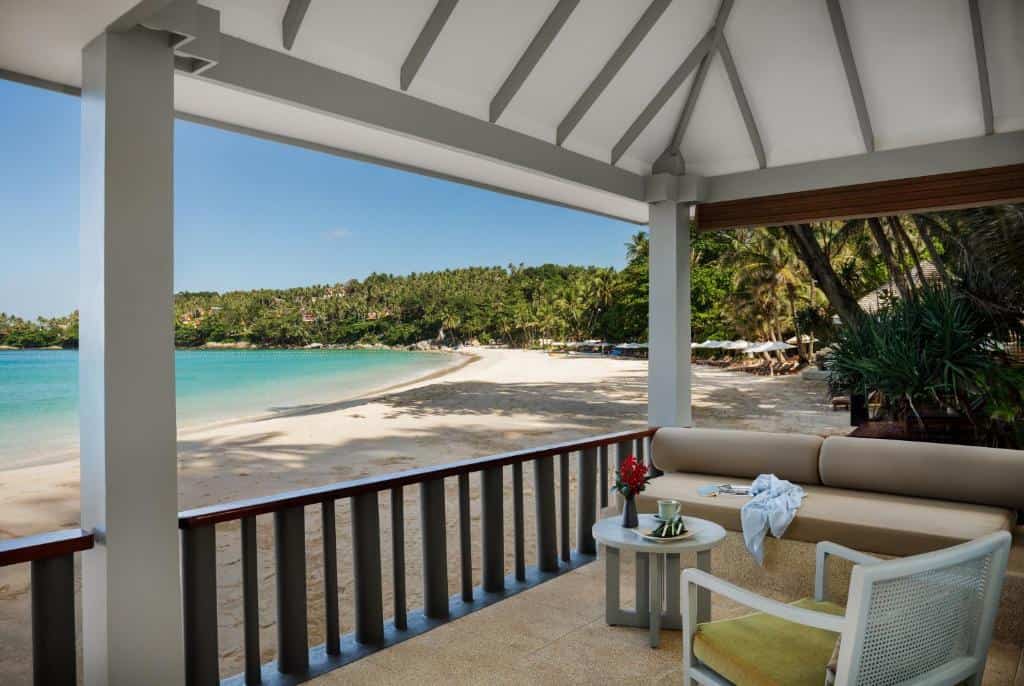 The Surin Phuket beachfront suite terrace overlooking Pansea Beach with white sand, turquoise water and tropical palms